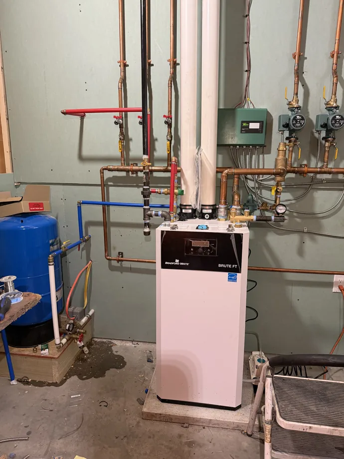 Hydronic heating equipment and organized copper distribution piping indoors